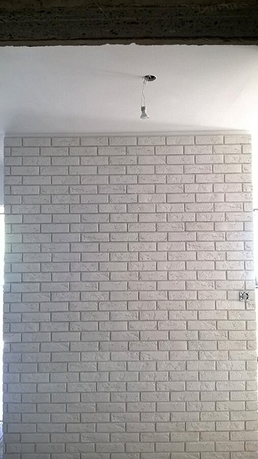 Rybnik, Brzezińska - położenie cegły dekoracyjnej na klatce schodowej - zdjęcie 1